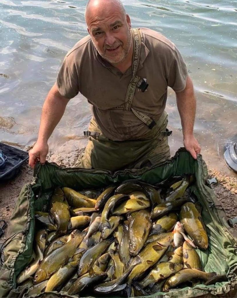 Julian White with a large catch of Tench.